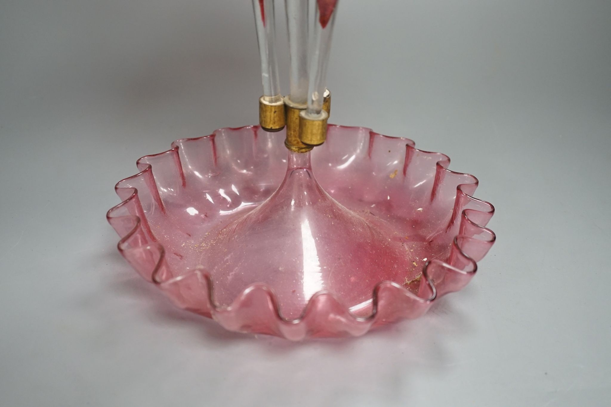 A Victorian cranberry glass four vase table centrepiece, 52 cms high.